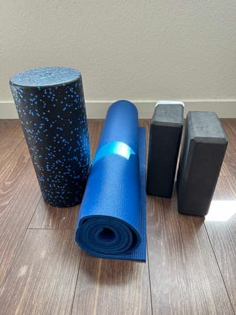 Foam roller with a yoga mat and two yoga blocks 2