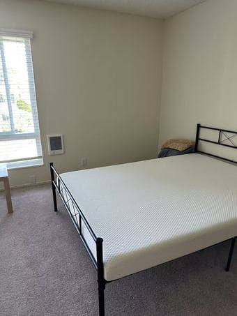 A bedroom in a 1B1B at Oak Creek Apartments is available 2