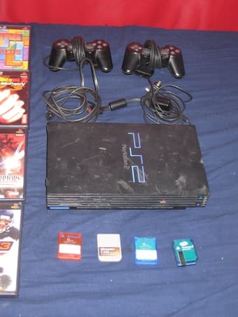 Playstation 2 + 24 games, 2 controllers & 4 memory cards - 215 obo 2