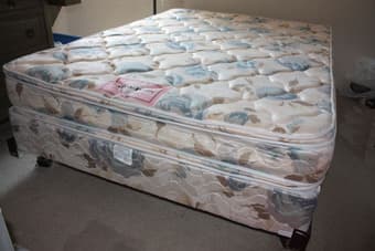 Double bed, chest of drawers, containters and books 2