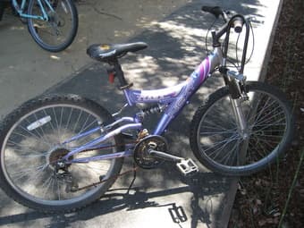 24" purple bike ($7 OBO) 1
