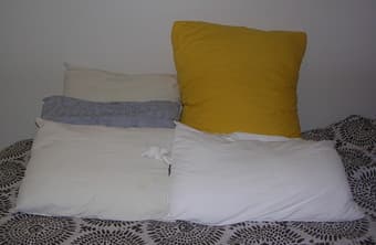 4 sleeping pillows and 1 yellow huge beautiful pillow - $14 1