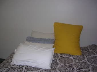 4 sleeping pillows and 1 yellow huge beautiful pillow - $14 2