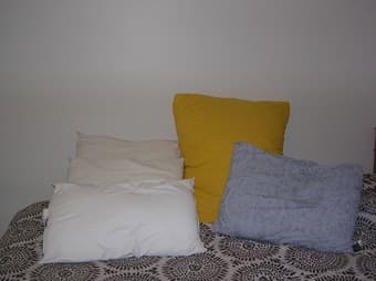 4 sleeping pillows and 1 yellow huge beautiful pillow - $14 3