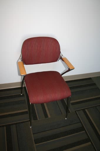 Four red office chairs - $30 OBO each 1