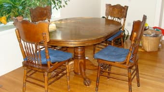 Oval, oak wood dining room table and four chairs for sale 1