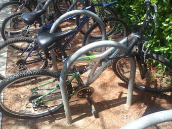 Triax adult mtn bike, silver/green, works fine, with lock $80 1