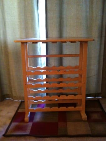 Wine Rack holds 24bottles and glasses.  =$25 1