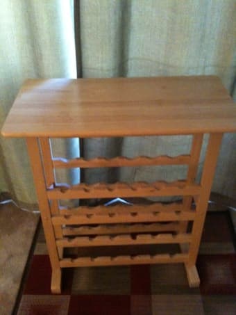 Wine Rack holds 24bottles and glasses.  =$25 2
