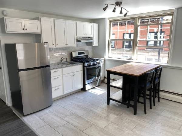 Avbl 8/1! Open, sunny, cozy studio downtown, utilities included! 1